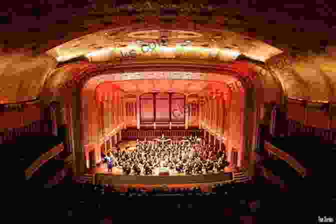 An Orchestra Performing On Stage In A Concert Hall How To Hear Classical Music (The Ginger 11)